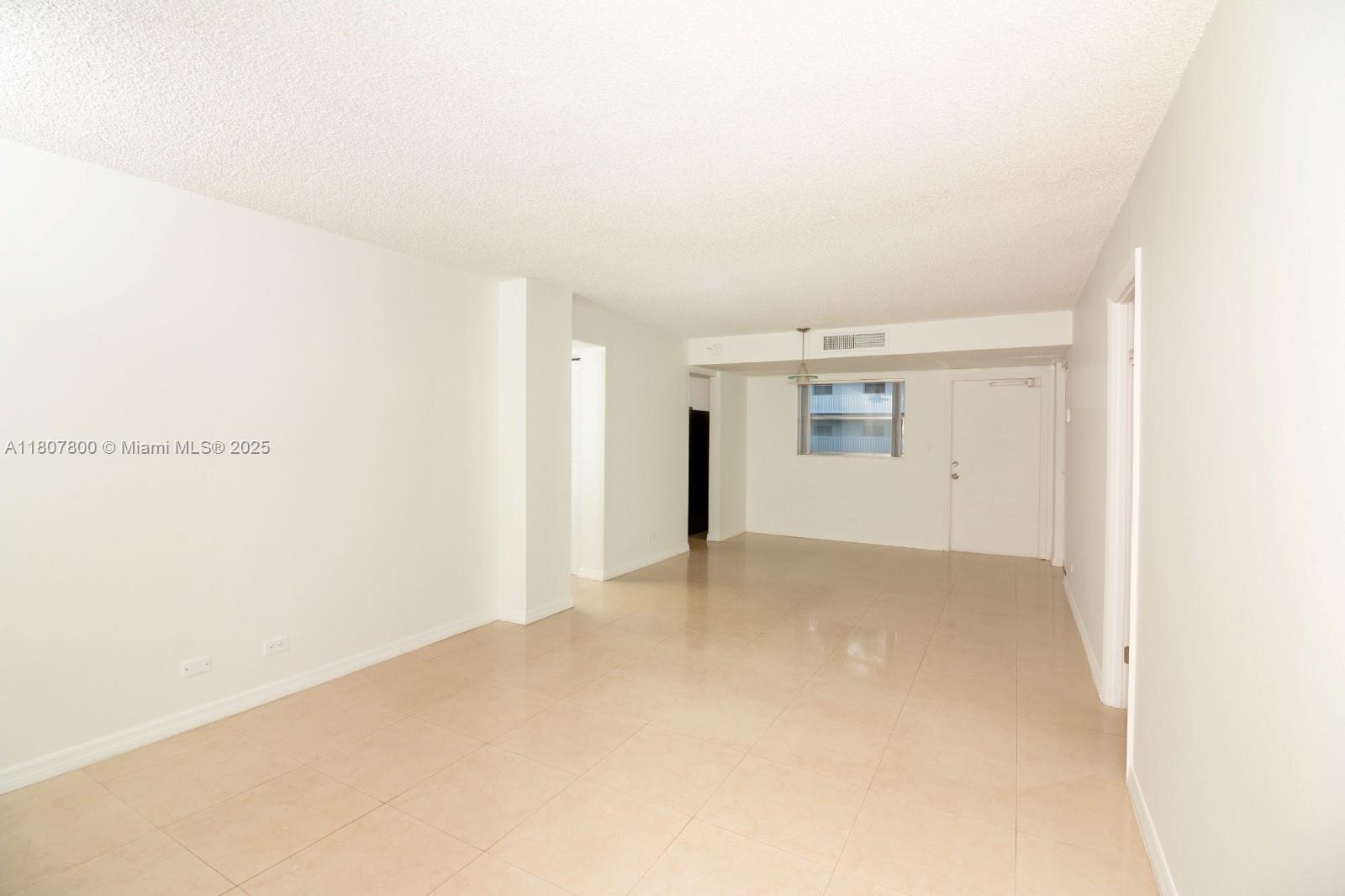 447 Northeast 195th Street, Unit 217 Miami, FL 33179 - Photo 22 of 22 a view of an empty room