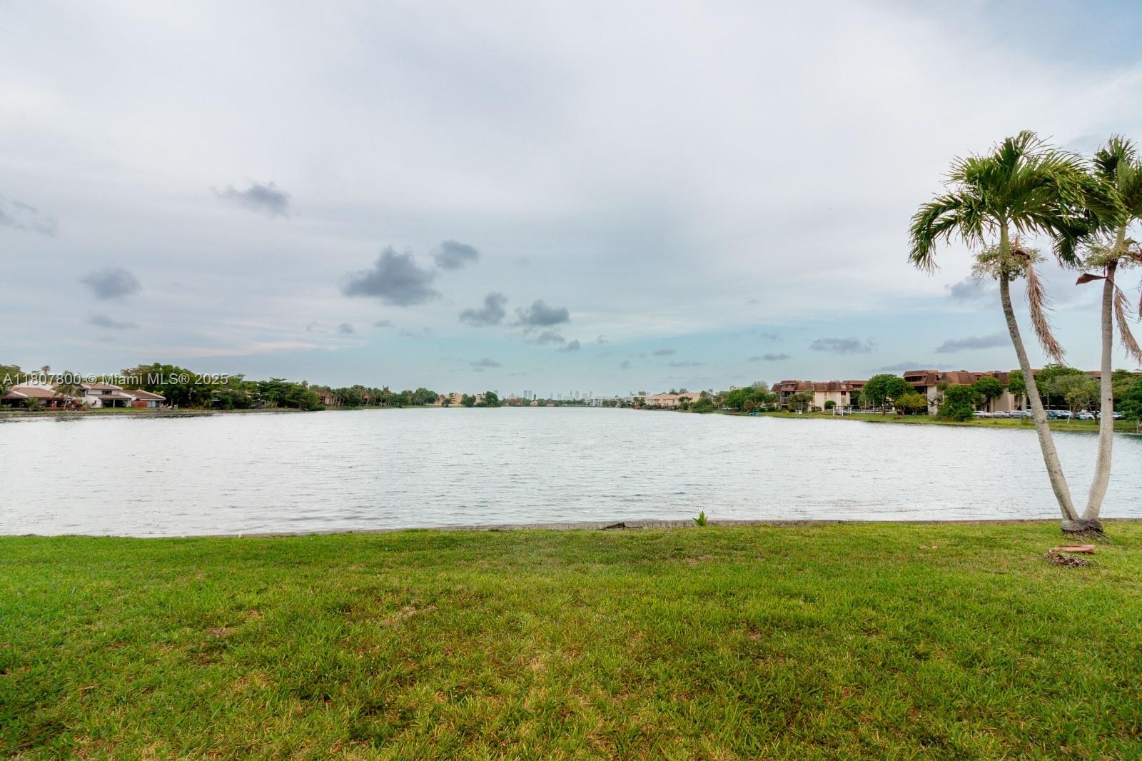 447 Northeast 195th Street, Unit 217 Miami, FL 33179 - Photo 7 of 22 a view of lake