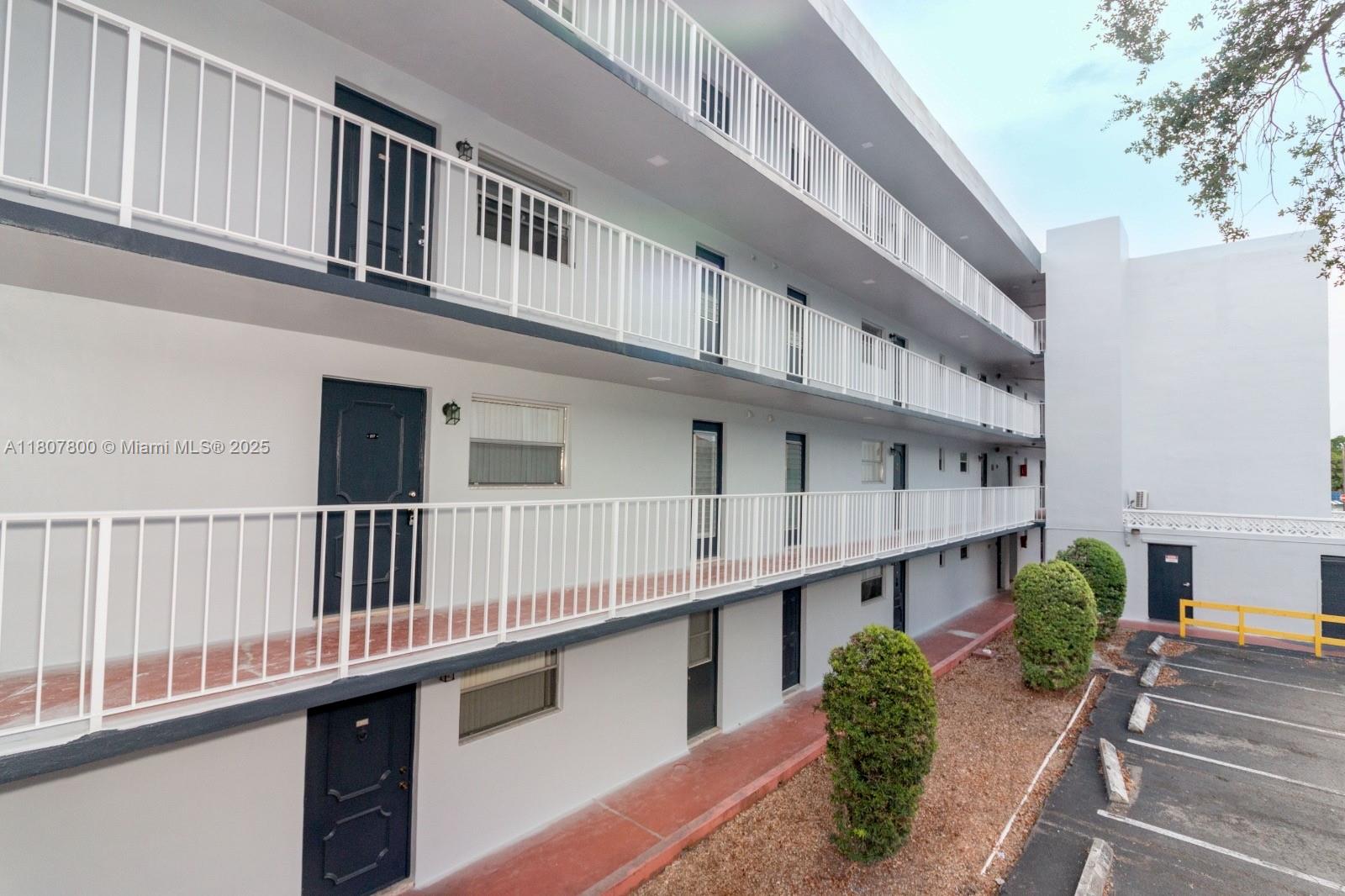 447 Northeast 195th Street, Unit 217 Miami, FL 33179 - Photo 10 of 22 a balcony with an entryway
