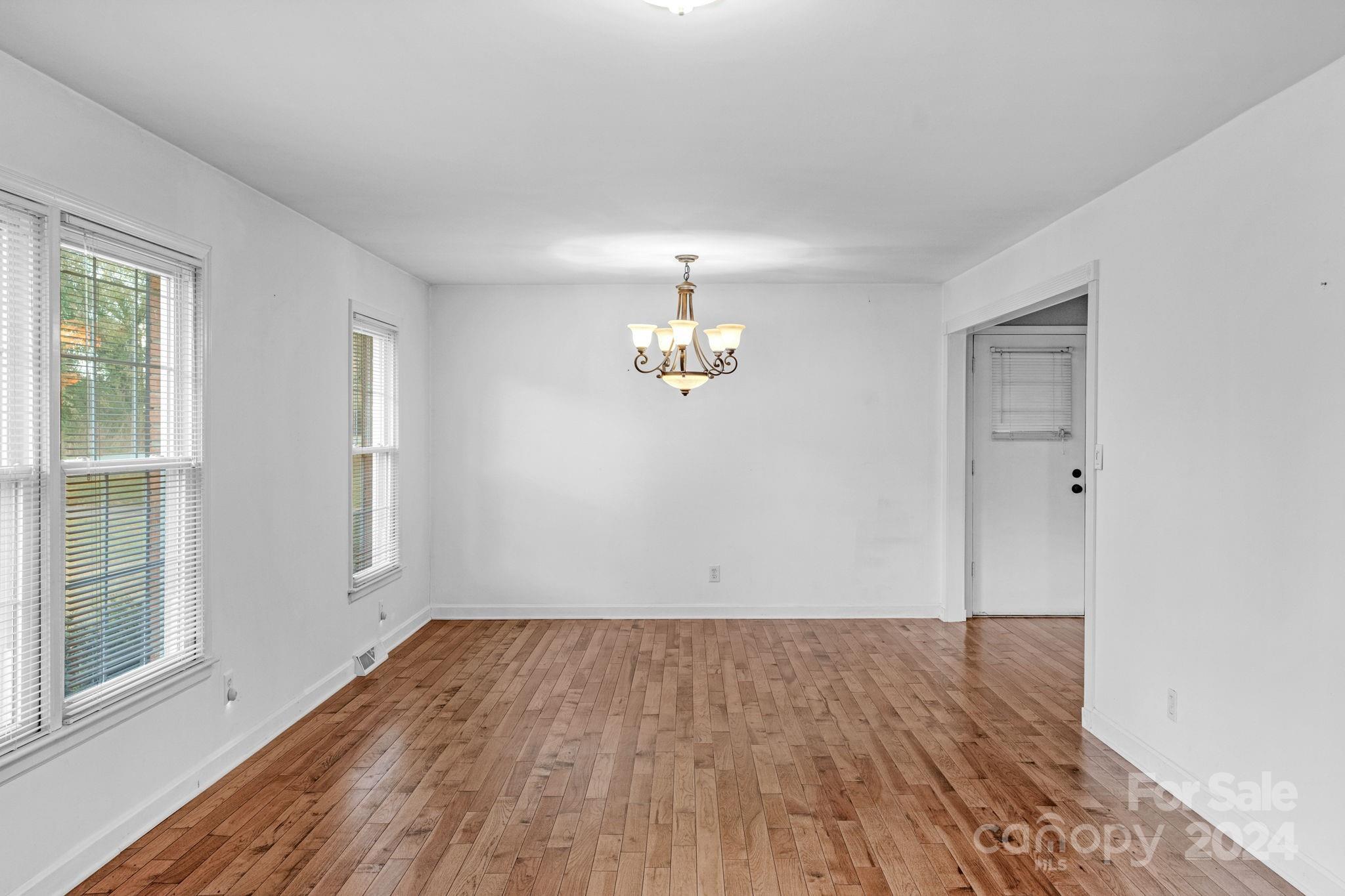 3704 Pinecrest Drive Gastonia, NC 28056 - Photo 26 of 48 wooden floor in an empty room with a window