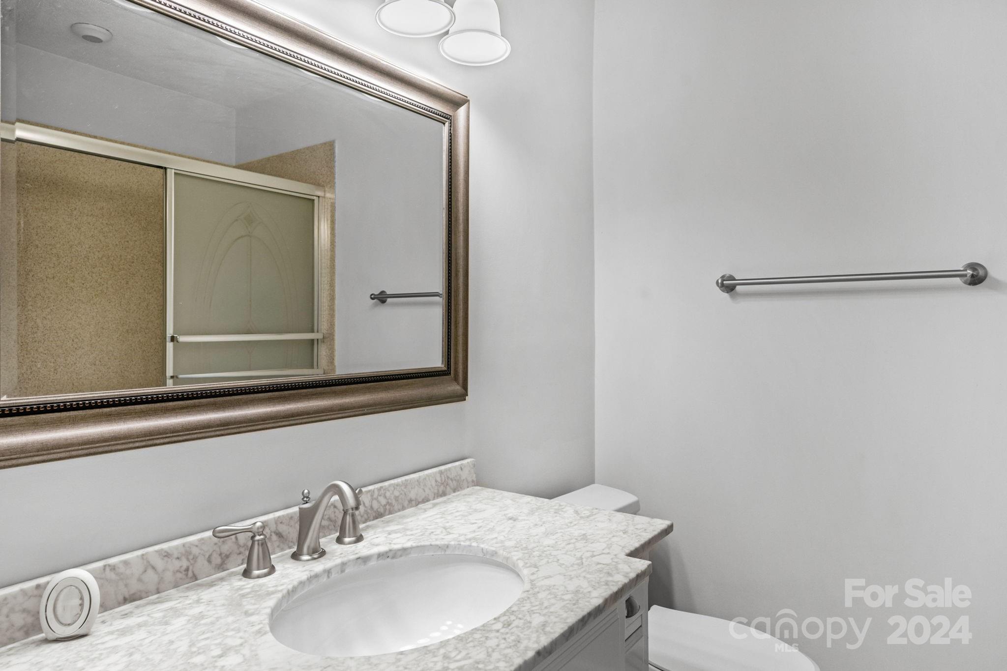 3704 Pinecrest Drive Gastonia, NC 28056 - Photo 33 of 48 a bathroom with a granite countertop sink and a mirror