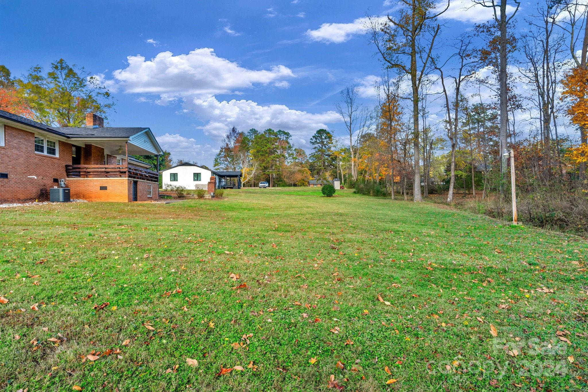 3704 Pinecrest Drive Gastonia, NC 28056 - Photo 47 of 48 a view of a house with a big yard and large trees