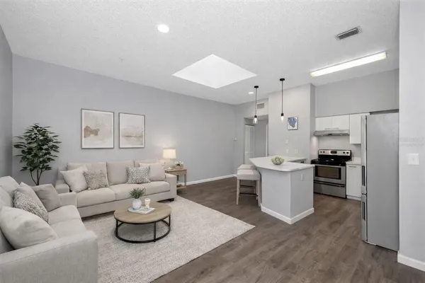 a living room with furniture and white walls