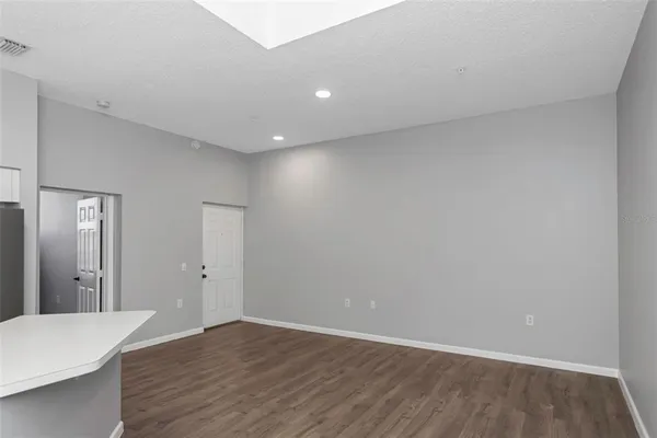 a view of a room with wooden floor and staircase