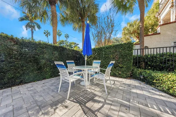 a view of a patio with a table and chairs