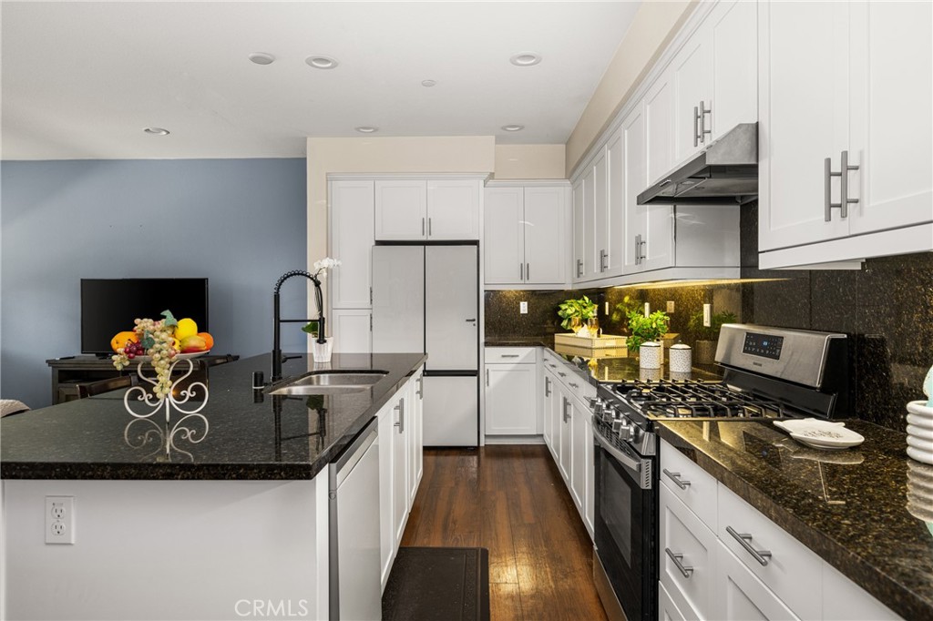 228 Borrego Irvine, CA 92618 - Photo 15 of 50 a kitchen with a sink a stove and cabinets