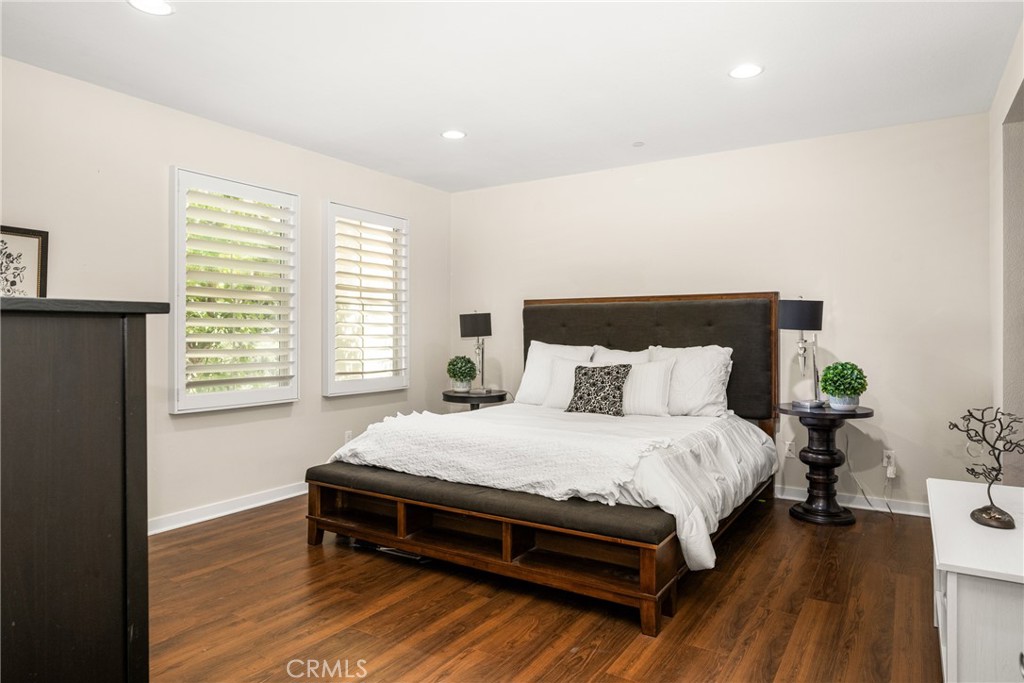 228 Borrego Irvine, CA 92618 - Photo 19 of 50 a bedroom with a bed and wooden floor