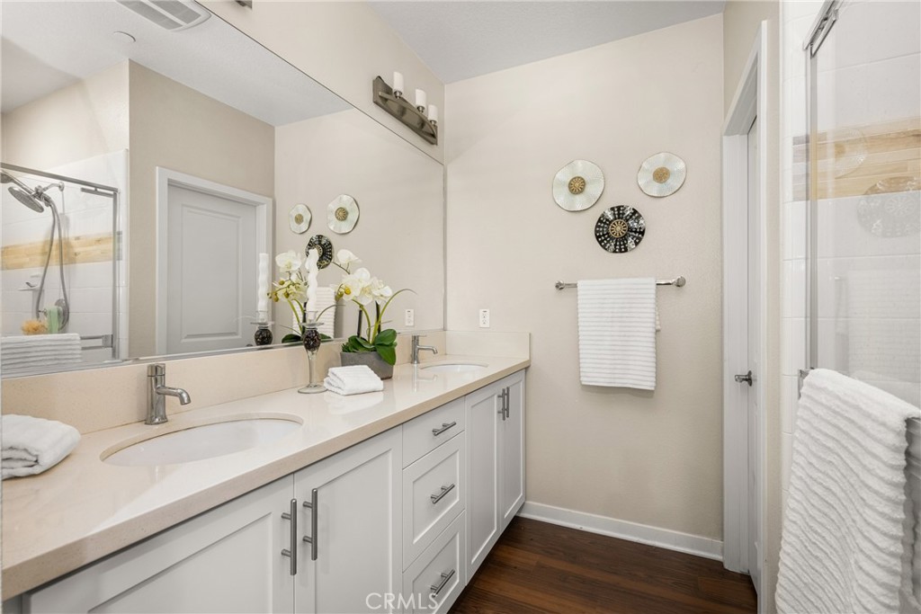228 Borrego Irvine, CA 92618 - Photo 23 of 50 a bathroom with a double vanity sink and mirror