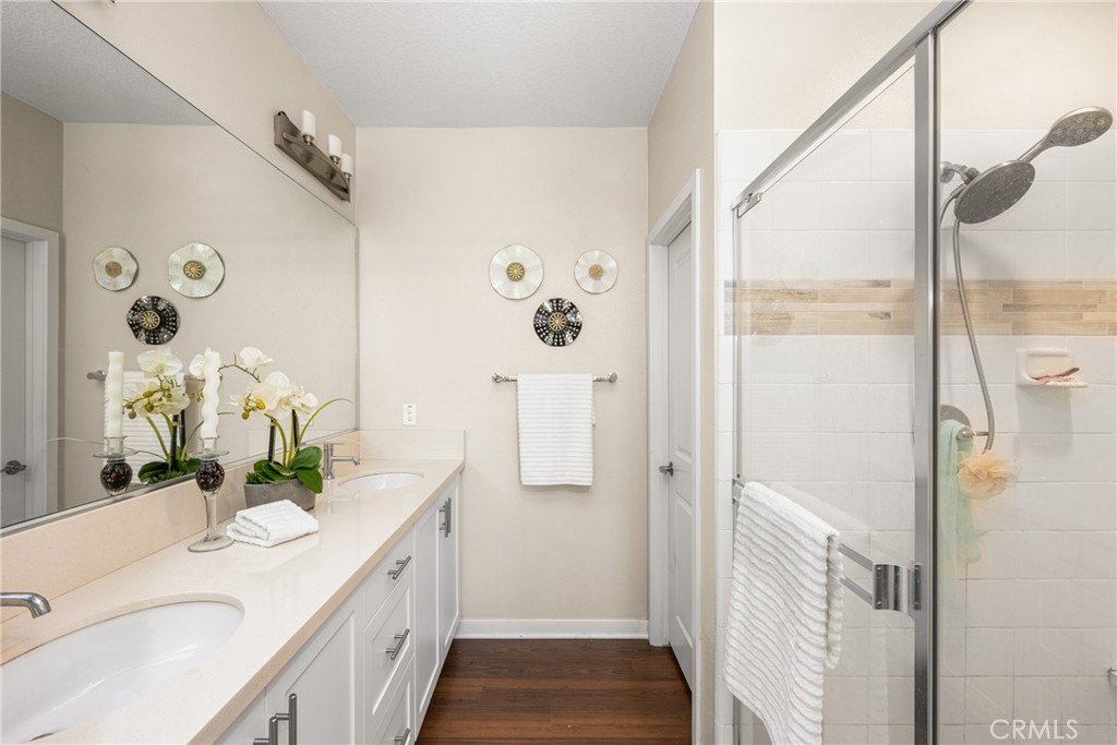 228 Borrego Irvine, CA 92618 - Photo 24 of 50 a bathroom with a granite countertop shower sink and mirror