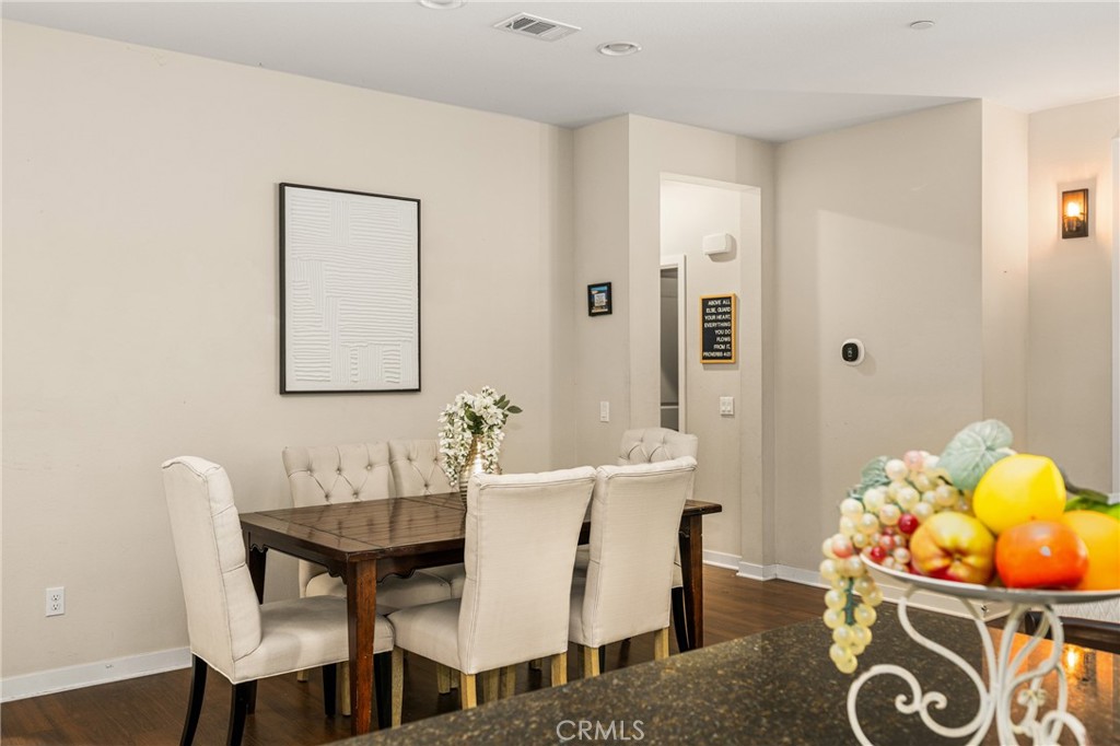 228 Borrego Irvine, CA 92618 - Photo 25 of 50 a view of a dining room with furniture and wooden floor