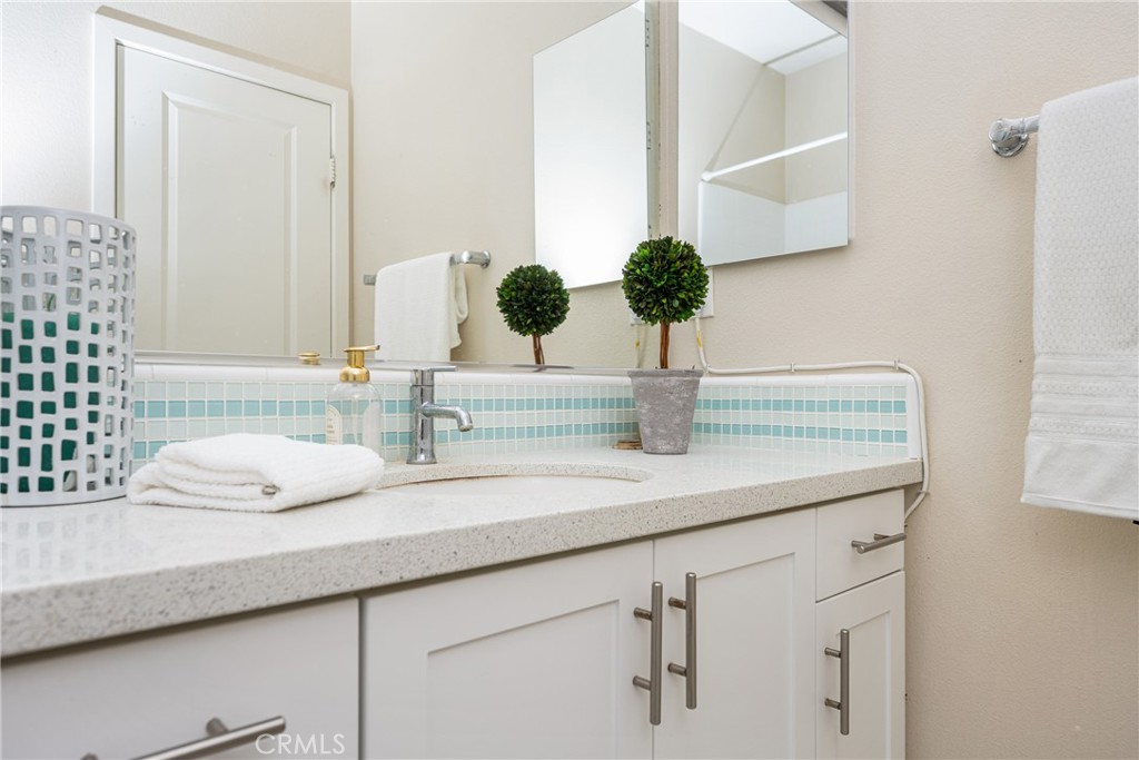 228 Borrego Irvine, CA 92618 - Photo 32 of 50 a bathroom with a sink and a mirror