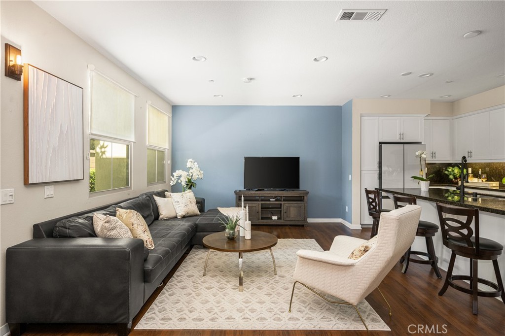 228 Borrego Irvine, CA 92618 - Photo 5 of 50 a living room with furniture a flat screen tv and a window