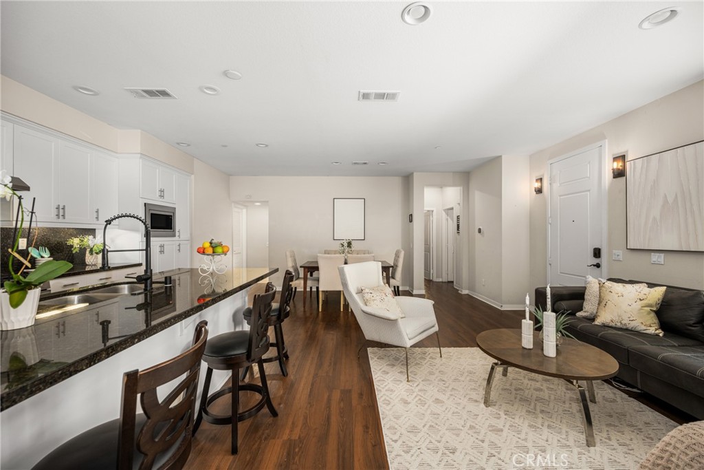 228 Borrego Irvine, CA 92618 - Photo 9 of 50 a living room with furniture a rug and white walls