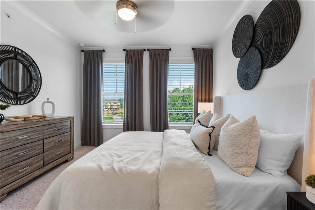 a bedroom with a large bed and a window