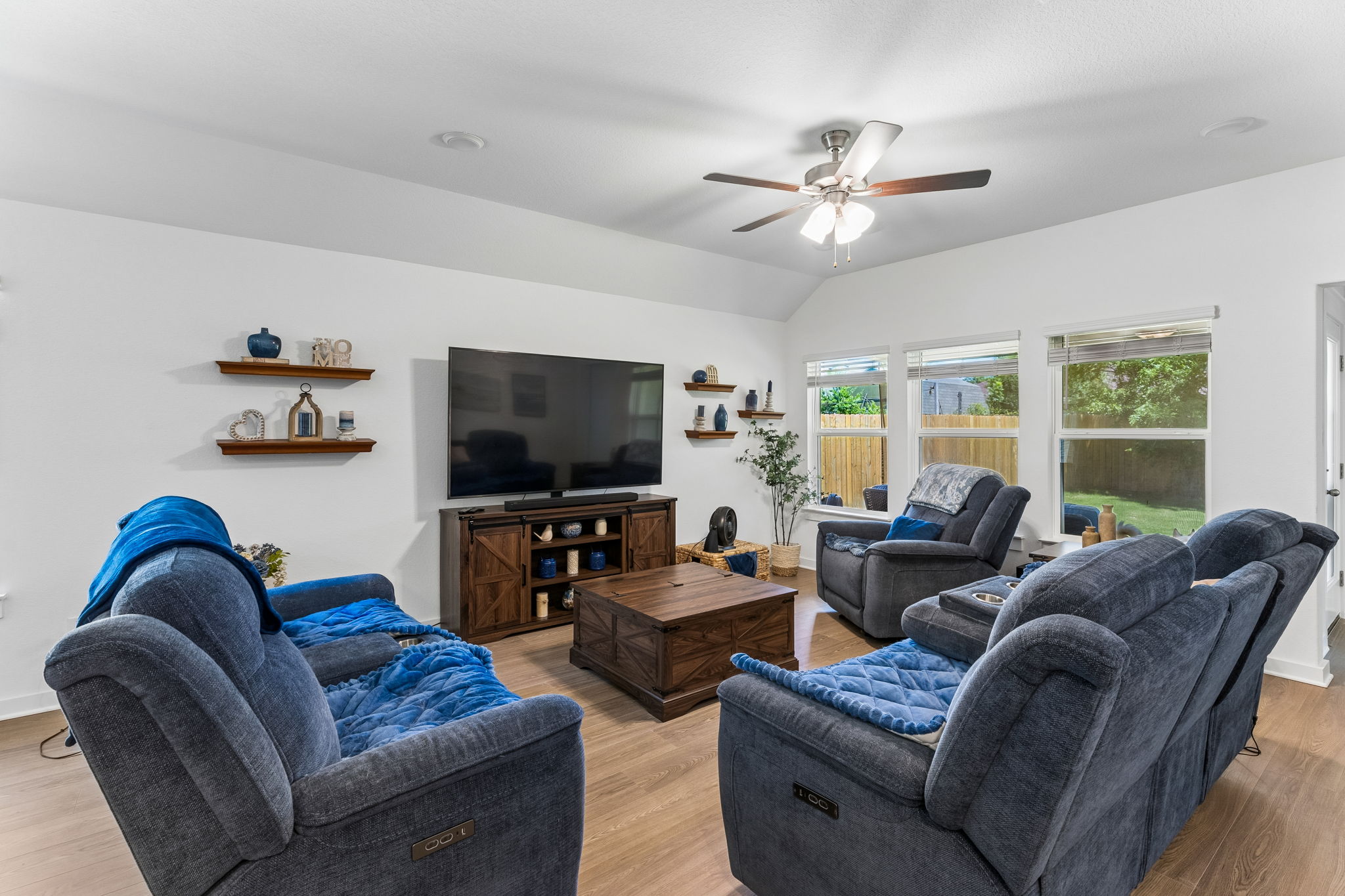 13509 Barn Chime Street Elgin, TX 78621 - Photo 12 of 40 Spacious living room overlooking backyard.