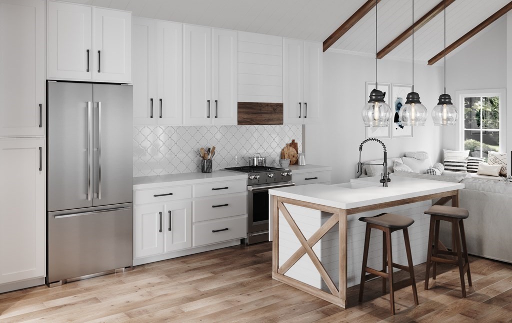 a kitchen with a table chairs refrigerator and cabinets