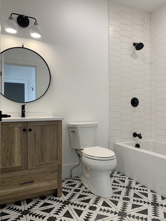 7 Sharon Avenue, Unit 7 Newton, MA 02466 - Photo 14 of 28 a bathroom with a toilet and a mirror