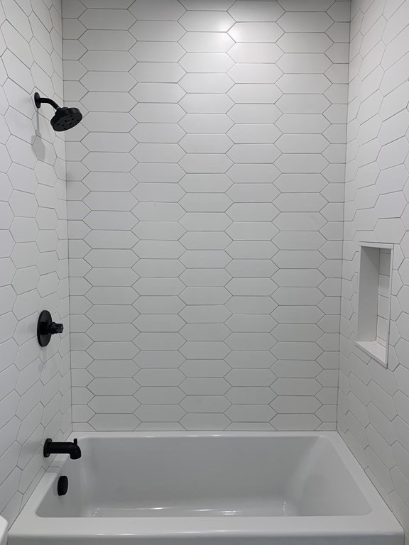 7 Sharon Avenue, Unit 7 Newton, MA 02466 - Photo 15 of 28 a bathroom with a bathtub