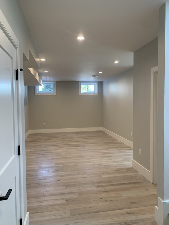 7 Sharon Avenue, Unit 7 Newton, MA 02466 - Photo 21 of 28 a view of empty room with wooden floor
