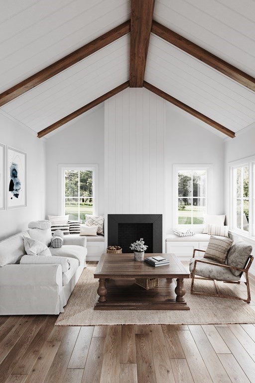 7 Sharon Avenue, Unit 7 Newton, MA 02466 - Photo 4 of 28 a living room with furniture and a fireplace
