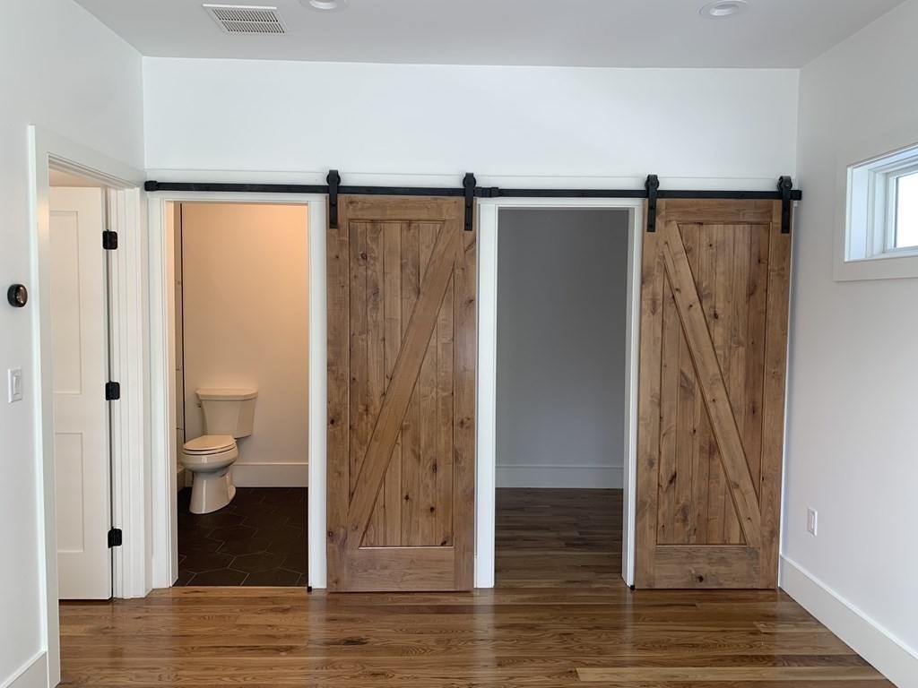 7 Sharon Avenue, Unit 7 Newton, MA 02466 - Photo 8 of 28 a view of bathroom with a shower and a toilet