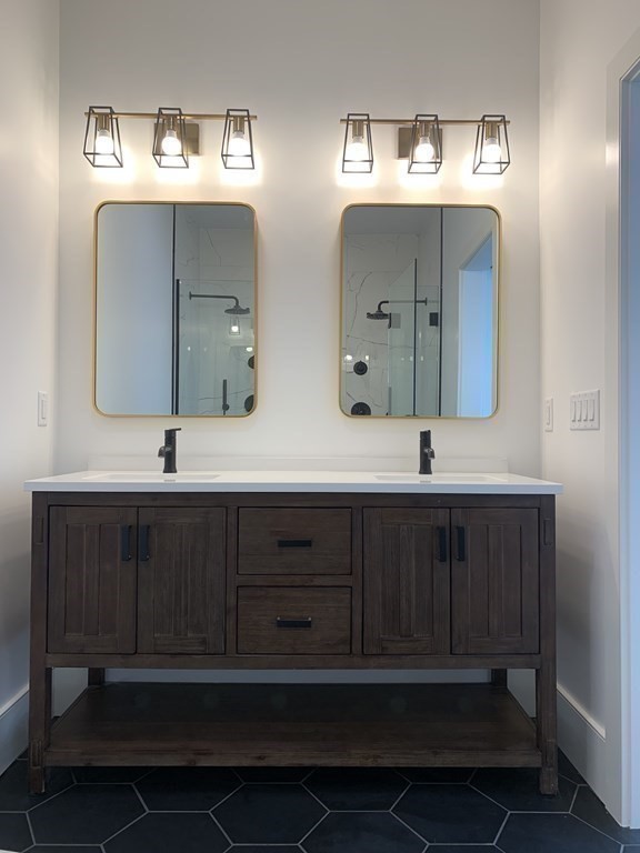 7 Sharon Avenue, Unit 7 Newton, MA 02466 - Photo 10 of 28 a bathroom with a double vanity sink and a mirror
