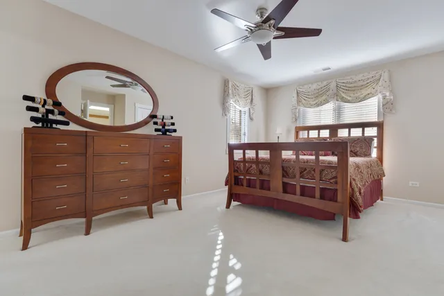 a bedroom with a bed and a dresser