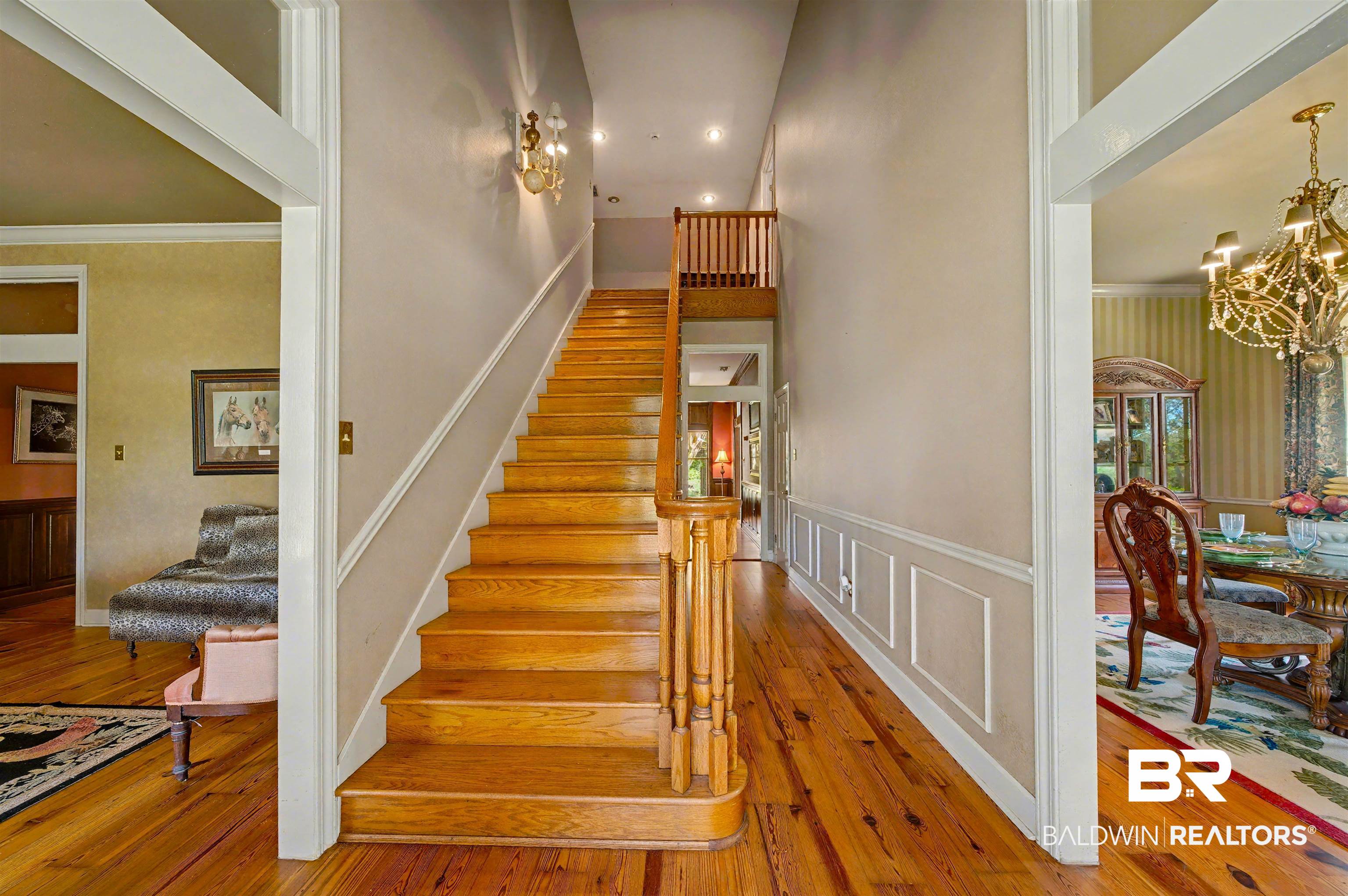 15810 County Road 73 Foley, AL 36535 - Photo 11 of 56 Staircase with wood-type flooring, a chandelier, and crown molding