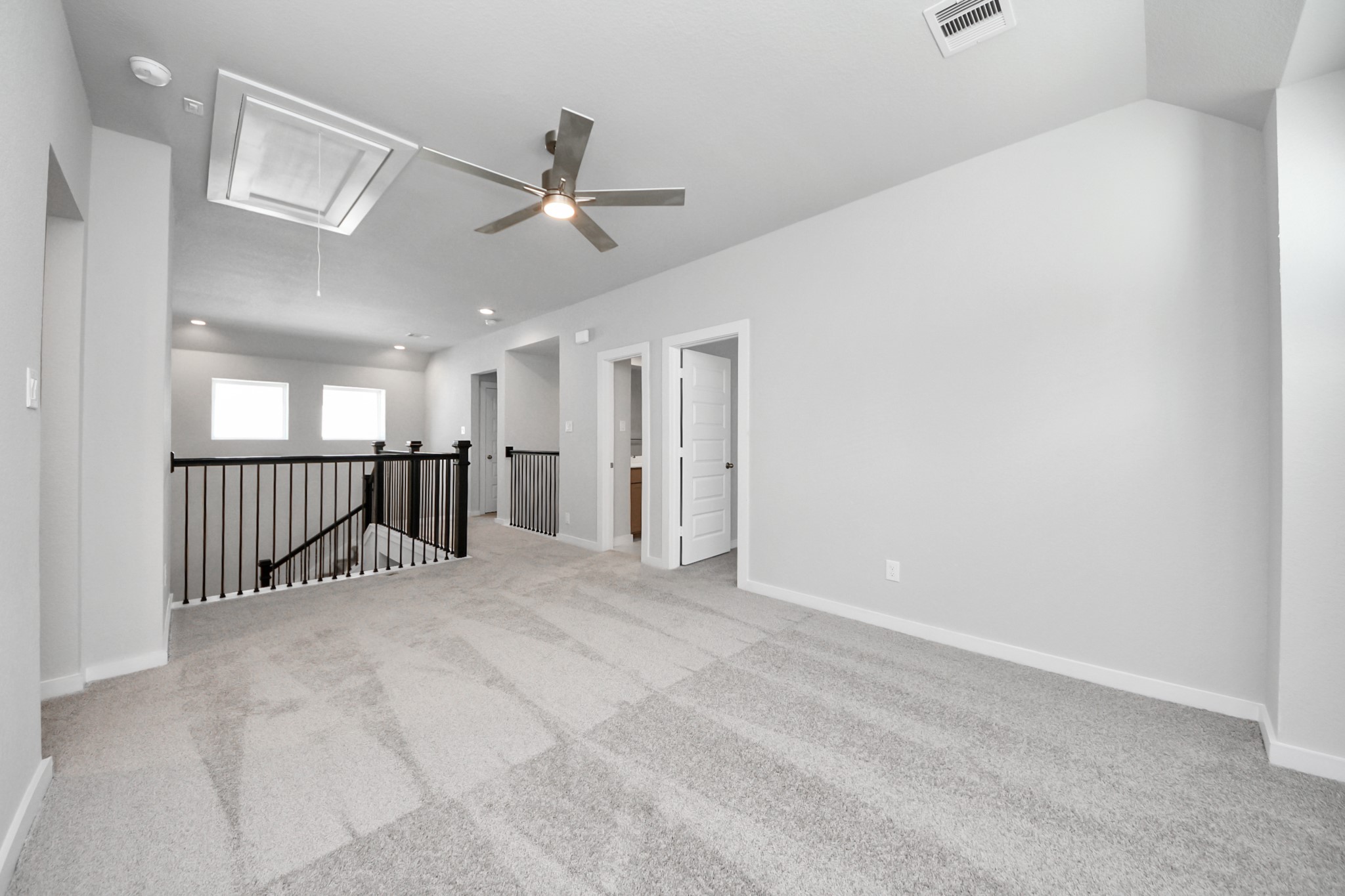 3002 Bury Park Dr Spring Spring, TX 77373 - Photo 34 of 45 Come upstairs and enjoy a day of leisure in this fabulous game room! This is the perfect hangout spot or adult game room! Features plush carpet, high ceilings, custom paint and windows for plenty of natural light.