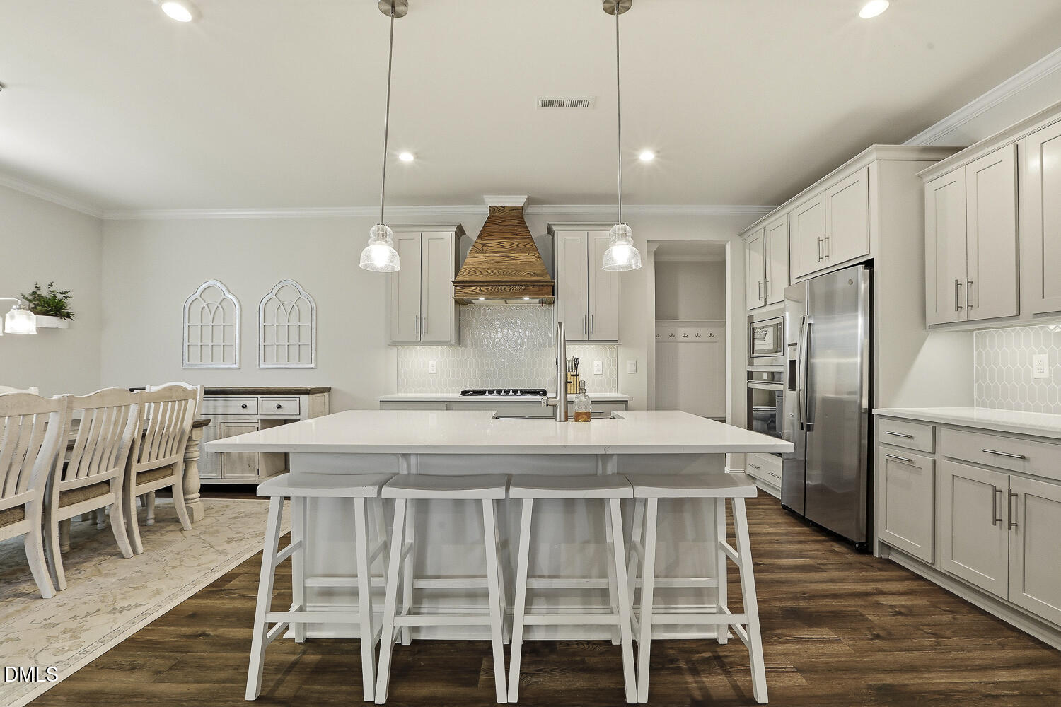 801 Oak Rose Lane Rolesville, NC 27571 - Photo 18 of 70 a kitchen with a table chairs refrigerator and microwave