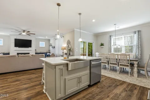 a kitchen with a sink stainless steel appliances and counter space
