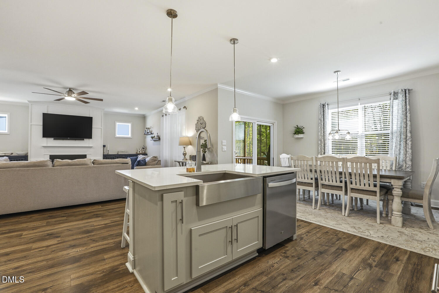 801 Oak Rose Lane Rolesville, NC 27571 - Photo 21 of 70 a large kitchen with kitchen island a stove a sink a dining table and chairs