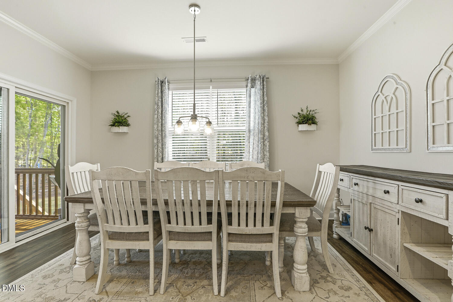 801 Oak Rose Lane Rolesville, NC 27571 - Photo 31 of 70 a view of a dining room with furniture window and wooden floor