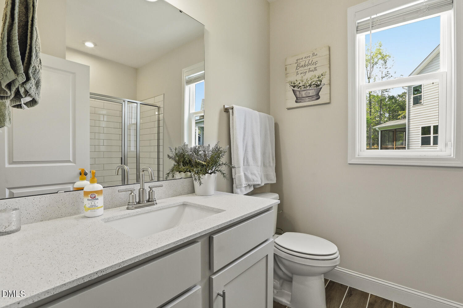 801 Oak Rose Lane Rolesville, NC 27571 - Photo 34 of 70 a bathroom with a sink a toilet and shower