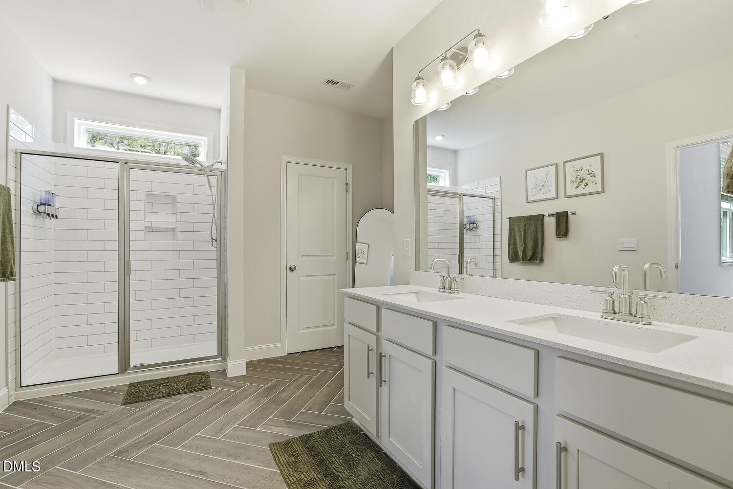 801 Oak Rose Lane Rolesville, NC 27571 - Photo 42 of 70 a bathroom with a double vanity sink and a mirror