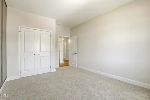 a view of a house with a large window and wooden floor