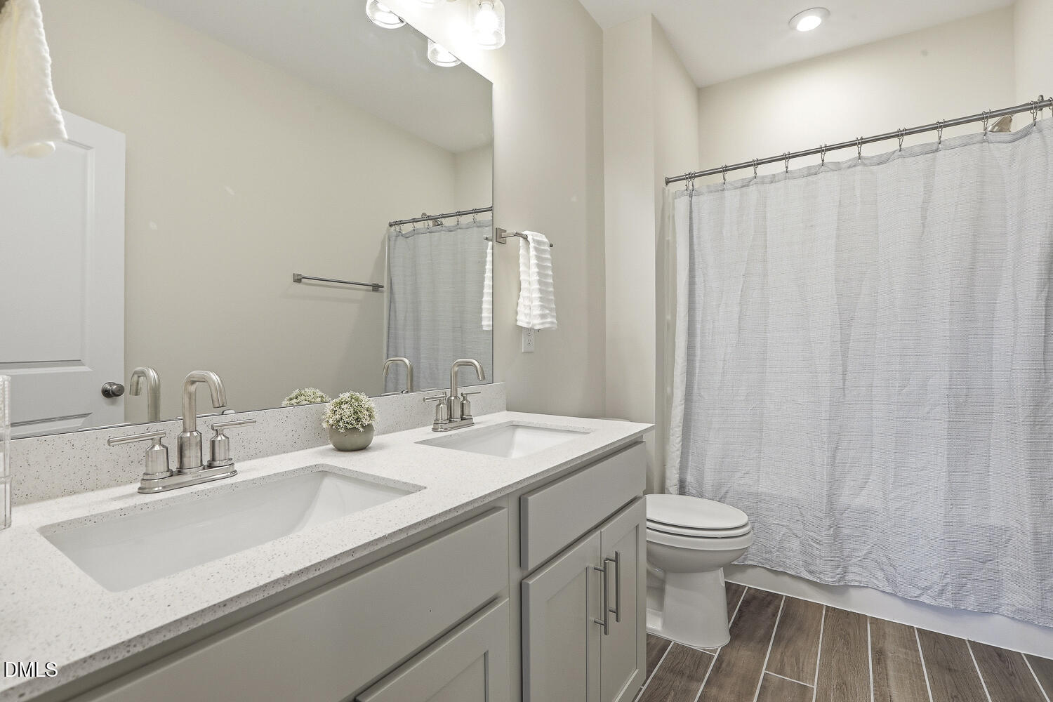 801 Oak Rose Lane Rolesville, NC 27571 - Photo 45 of 70 a bathroom with a sink a toilet and a mirror