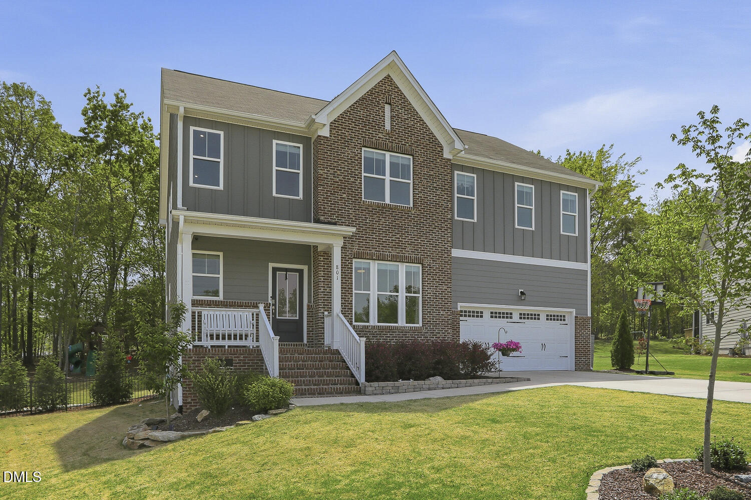 801 Oak Rose Lane Rolesville, NC 27571 - Photo 3 of 70 a front view of a house with garden