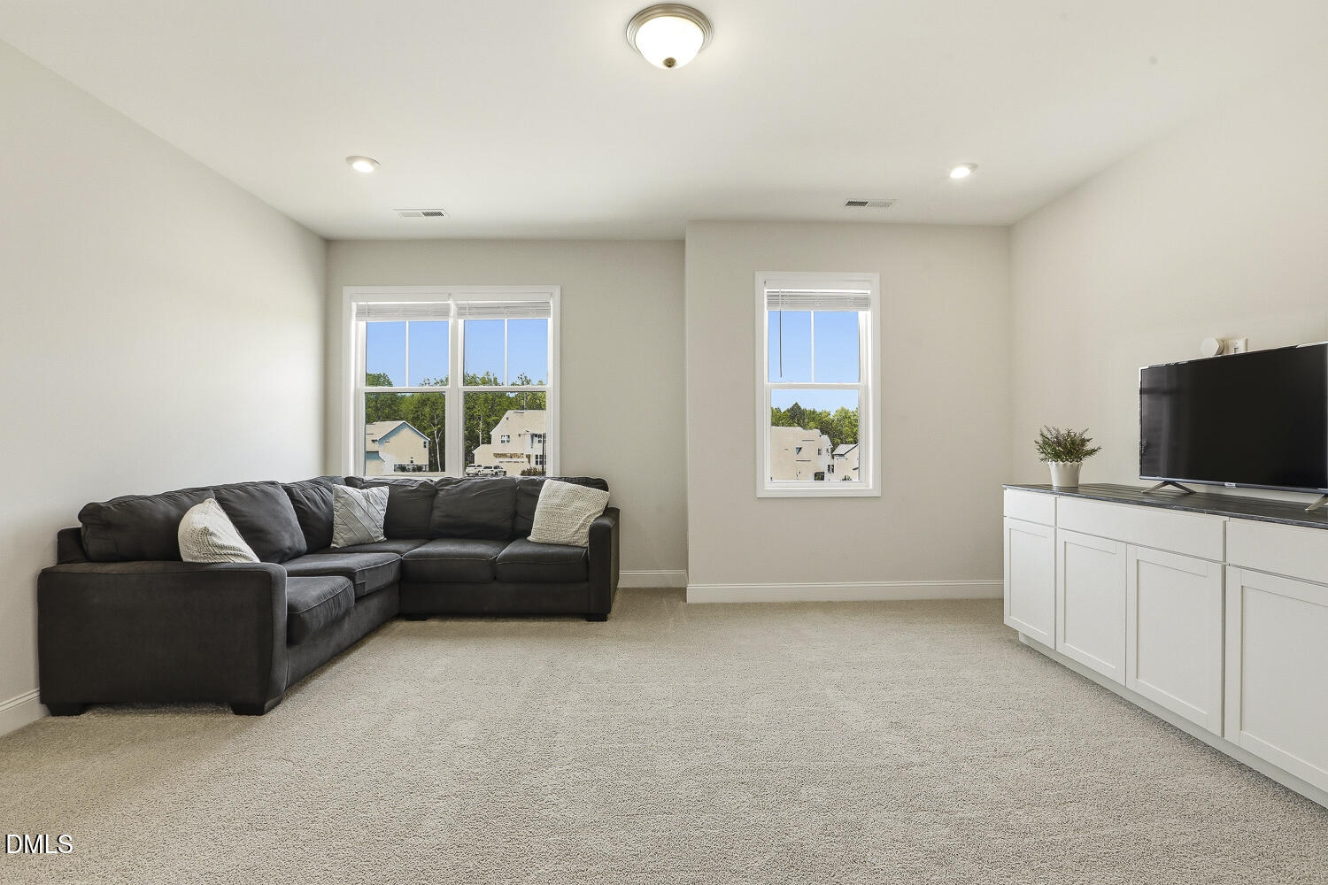 801 Oak Rose Lane Rolesville, NC 27571 - Photo 51 of 70 a living room with furniture and a flat screen tv