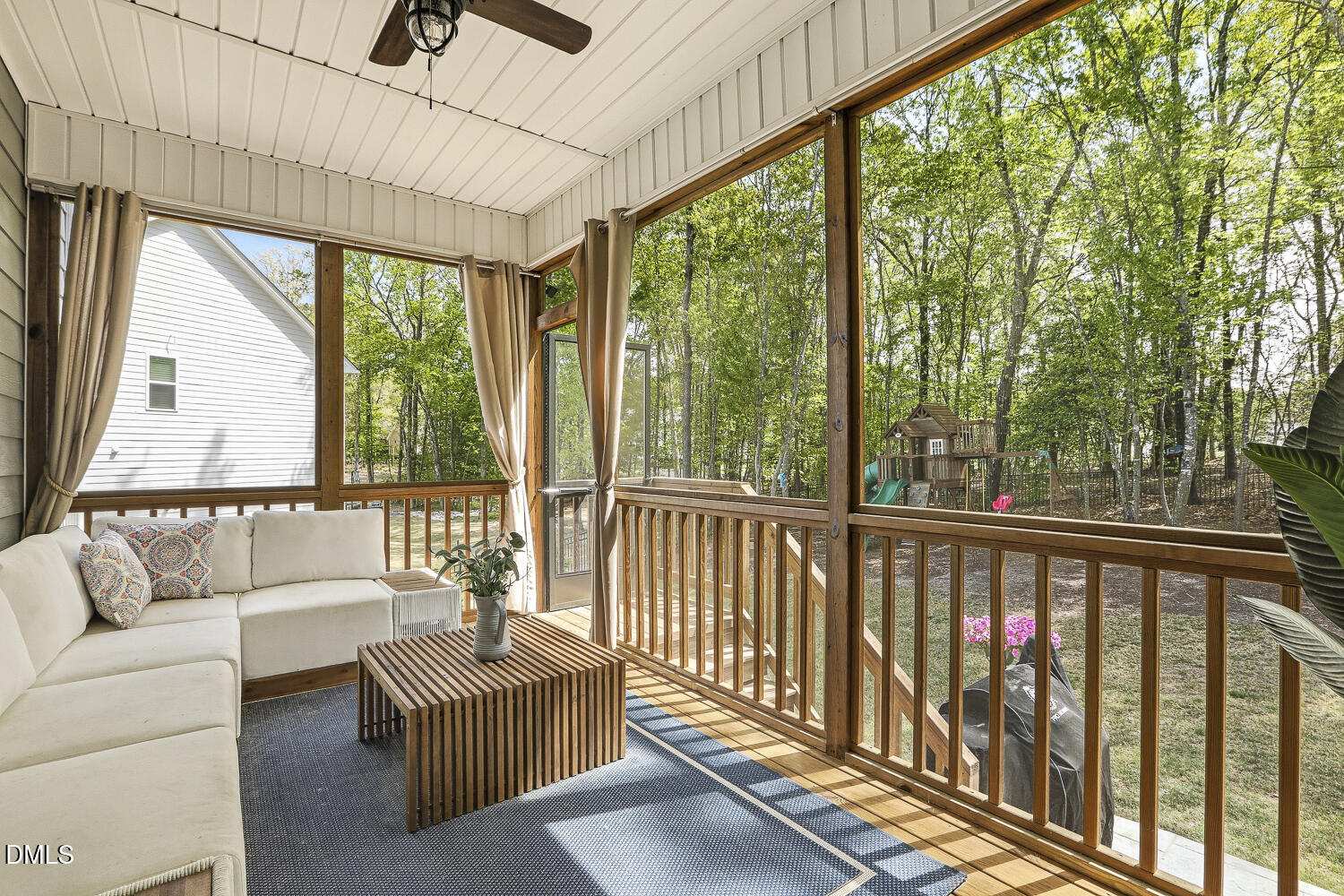 801 Oak Rose Lane Rolesville, NC 27571 - Photo 55 of 70 a living room with furniture and a floor to ceiling window