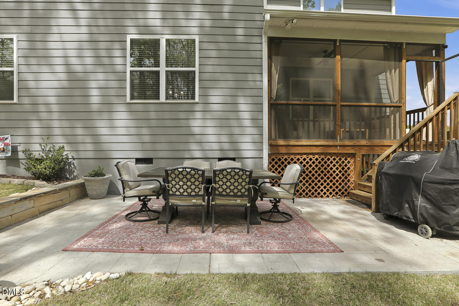 801 Oak Rose Lane Rolesville, NC 27571 - Photo 58 of 70 a patio with table and chairs and potted plants