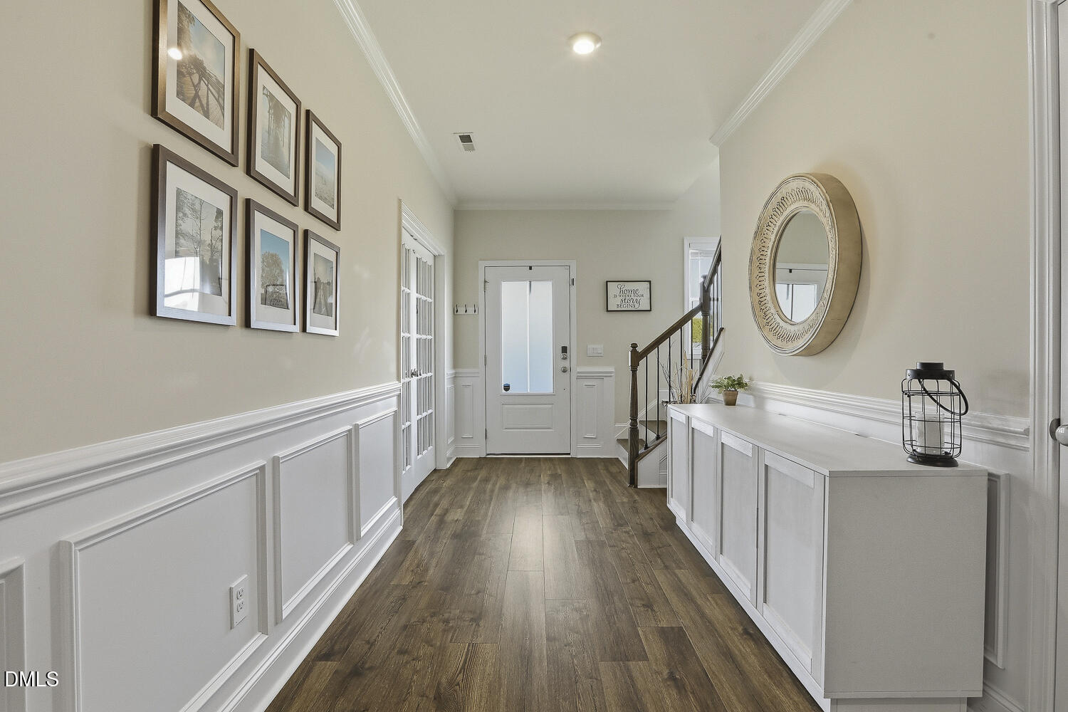 801 Oak Rose Lane Rolesville, NC 27571 - Photo 6 of 70 a hallway with white cabinets and wooden floor
