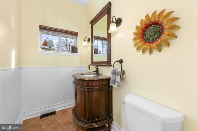 a view of a room with wooden floor and windows