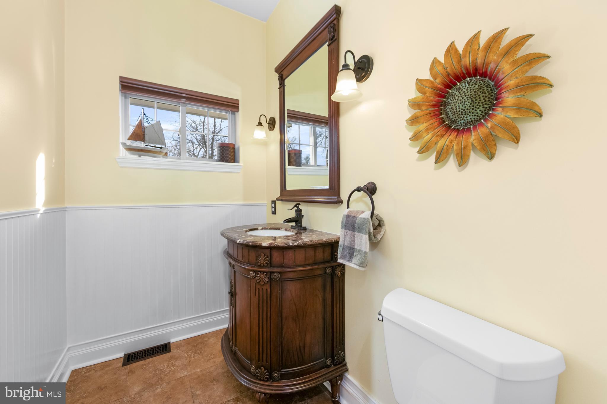 117 State Avenue Lindenwold, NJ 08021 - Photo 15 of 50 a bathroom with a toilet a sink and mirror