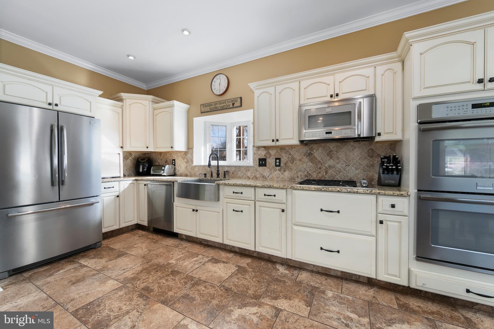 117 State Avenue Lindenwold, NJ 08021 - Photo 22 of 50 a kitchen with granite countertop white cabinets stainless steel appliances and a sink