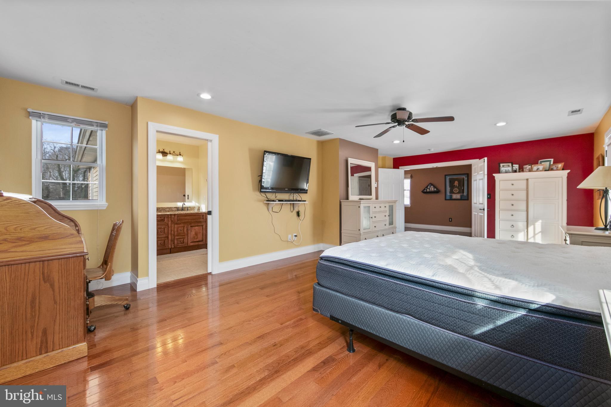 117 State Avenue Lindenwold, NJ 08021 - Photo 28 of 50 a spacious bedroom with a bed and wooden floor