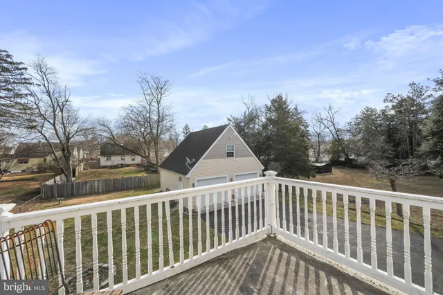 a bedroom with furniture and wooden floor