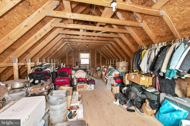 a view of a house with backyard porch and sitting area