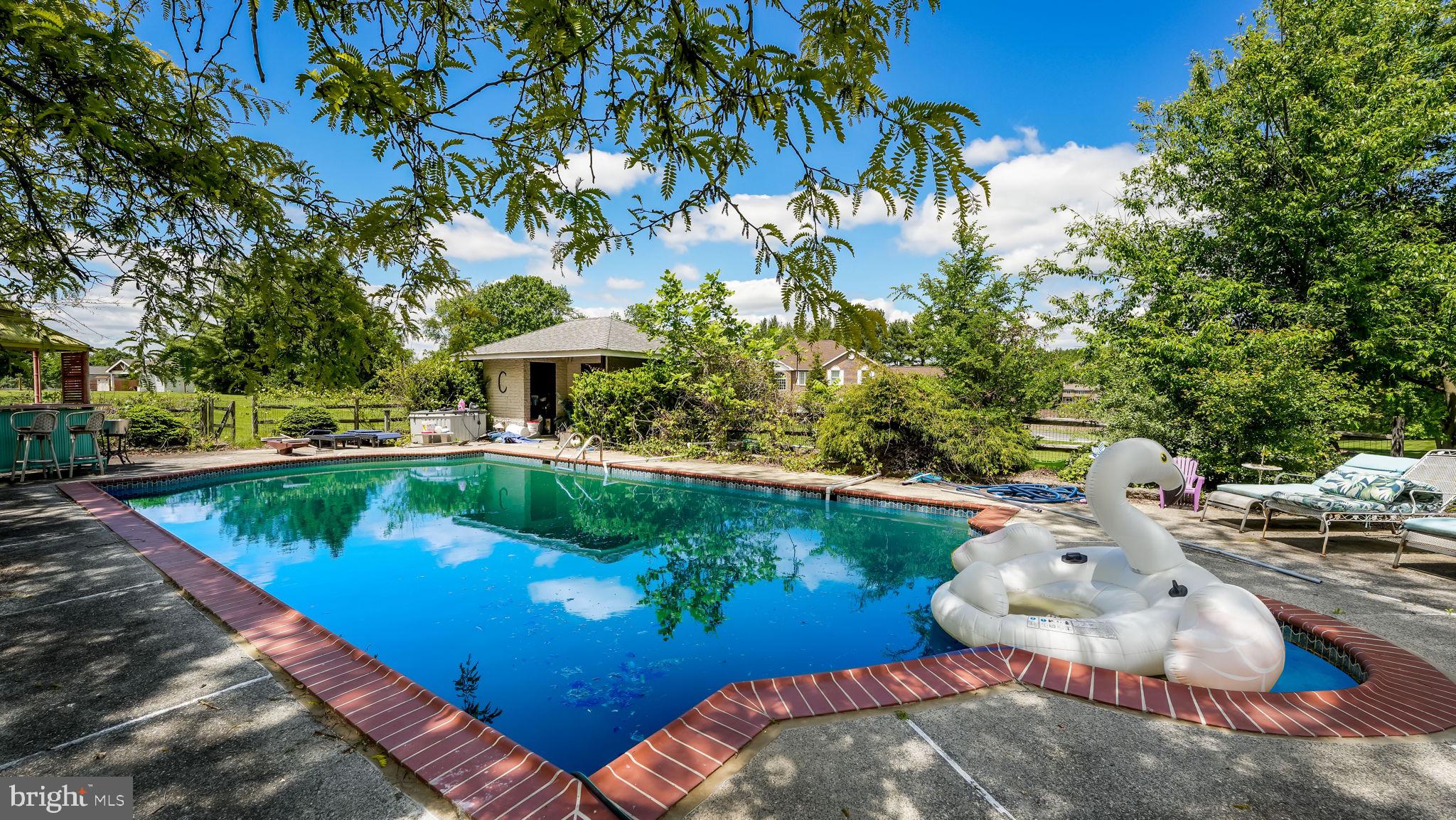 1591 Middletown Road Glen Mills, PA 19342 - Photo 25 of 55 a view of a swimming pool with a patio