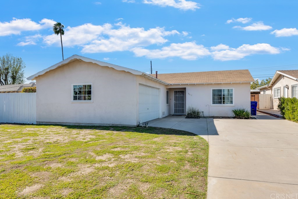 9617 Ruffner Avenue Northridge, CA 91343 - Photo 1 of 1 a backyard of a house with table and chairs